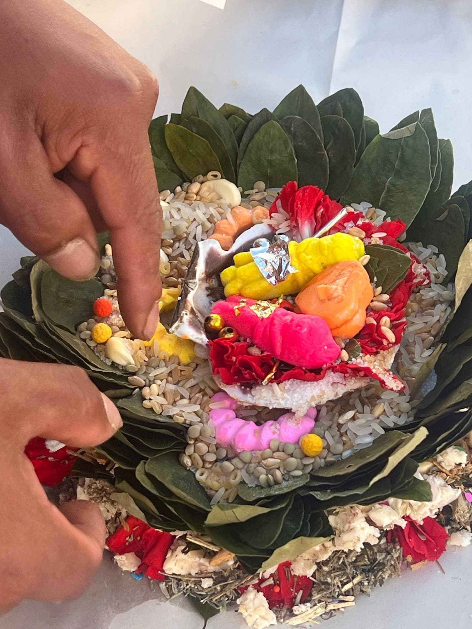 Colorful despacho offering materials prepared on woven textiles